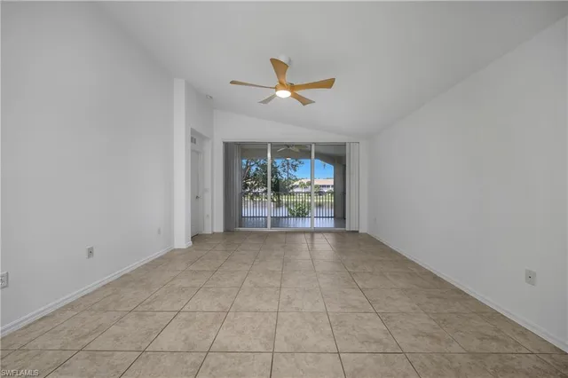 a view of n empty room with a window