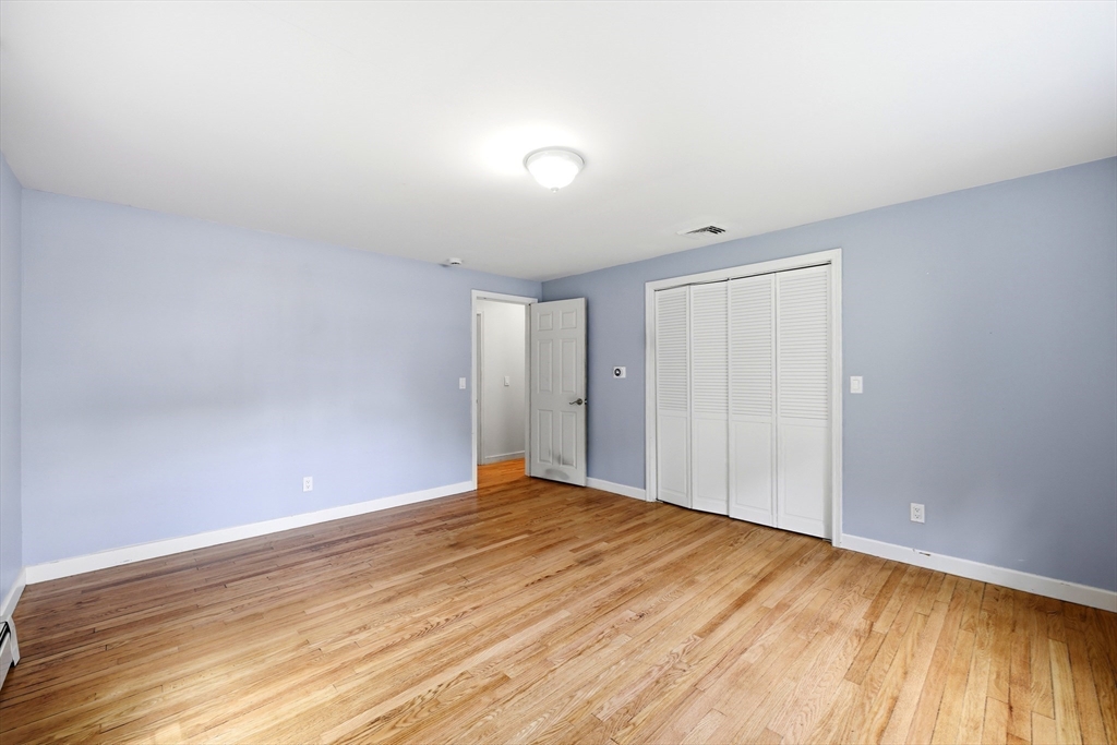 130 Connecticut Avenue Springfield, MA 01107 - Photo 34 of 40 a view of an empty room with wooden floor