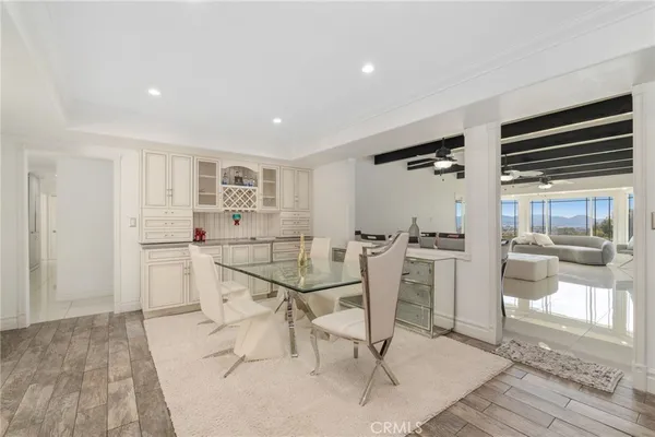a view of a kitchen with wooden floor and a kitchen