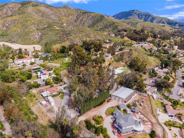 an aerial view of residential house with parking space