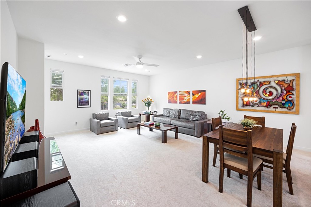 138 Acamar Irvine, CA 92618 - Photo 4 of 35 a living room with furniture and a flat screen tv