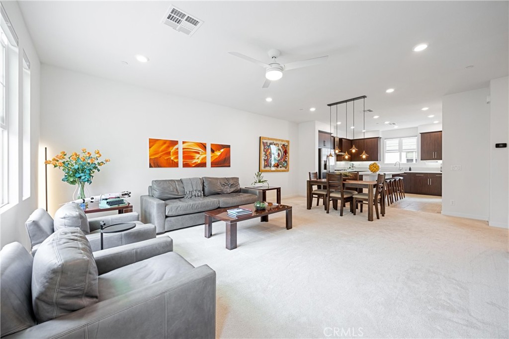 138 Acamar Irvine, CA 92618 - Photo 5 of 35 a living room with furniture and a flat screen tv
