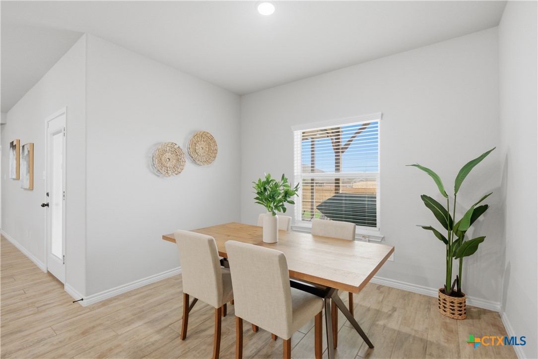 3201 Hedwig Street Killeen, TX 76549 - Photo 13 of 38 a dining room with furniture and wooden floor