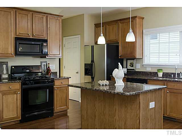 10624 Longholme Way Raleigh, NC 27614 - Photo 5 of 12 Beautiful island for food prep or for casual dining, and OPEN to the family room.