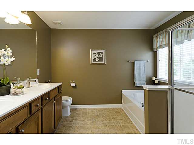 10624 Longholme Way Raleigh, NC 27614 - Photo 9 of 12 Room for two in this warm toned master bath with double sinks and marble counter-tops. Enjoy the garden tub or a nice hot shower!