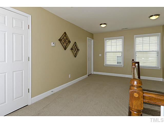 10624 Longholme Way Raleigh, NC 27614 - Photo 10 of 12 Loft area is large enough for multiple uses. A small office or reading nook would be perfect for this area.
