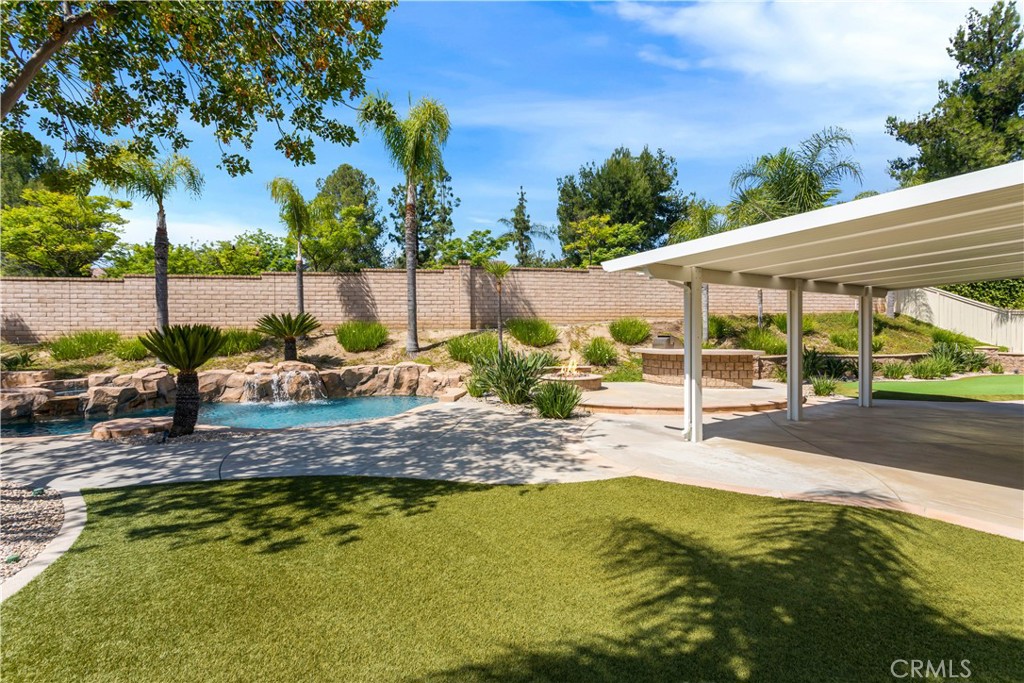 33351 Nicholas Common Temecula, CA 92592 - Photo 37 of 42 a view of a backyard with plants and swimming pool