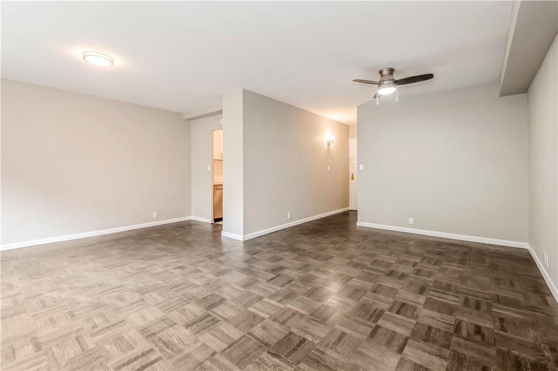 9 Fordham Hill Ovl, Unit 4F Bronx, NY 10468 - Photo 5 of 14 Unfurnished room with ceiling fan and dark parquet flooring