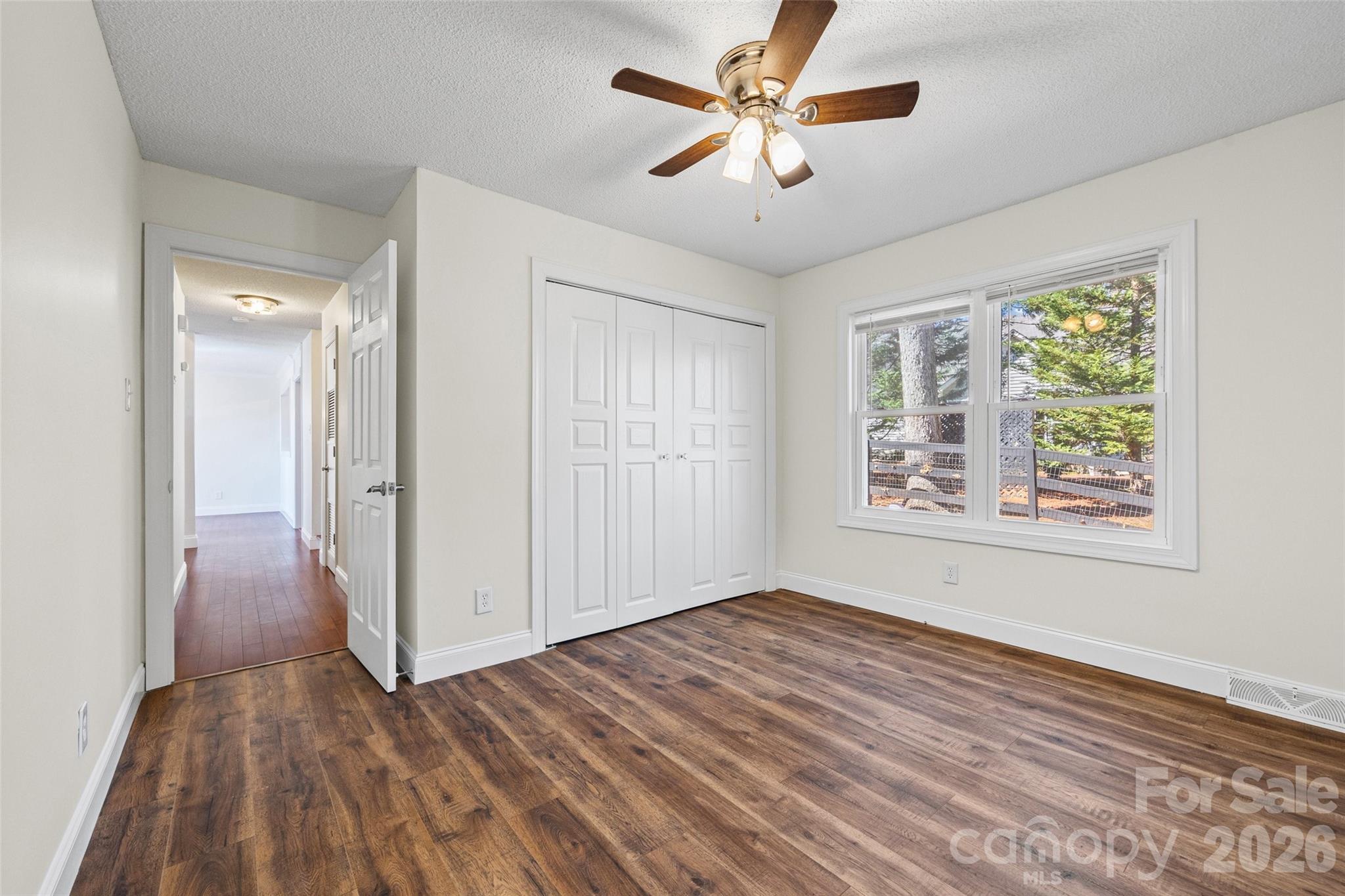16149 Haroa Court Fort Mill, SC 29708 - Photo 16 of 43 wooden floor in an empty room with a window