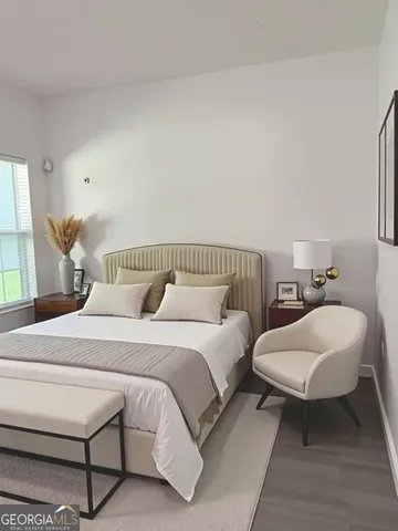 a spacious bedroom with a bed and a couch