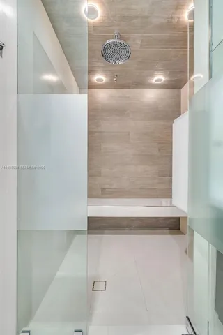 a city view from a balcony with an outdoor seating