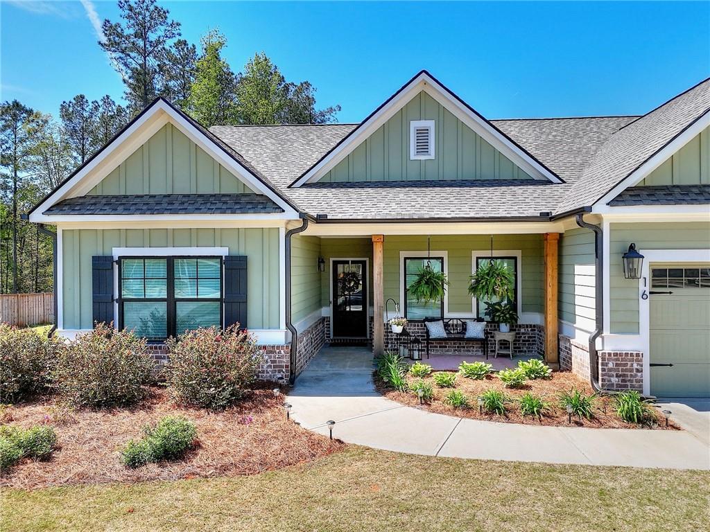16 Boxwood Court Monroe, GA 30655 - Photo 3 of 41 a front view of a house with garden