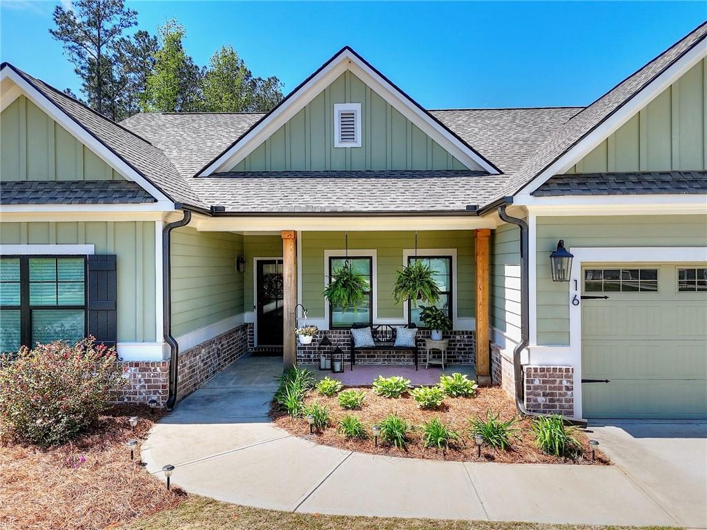 16 Boxwood Court Monroe, GA 30655 - Photo 4 of 41 a front view of a house with garden
