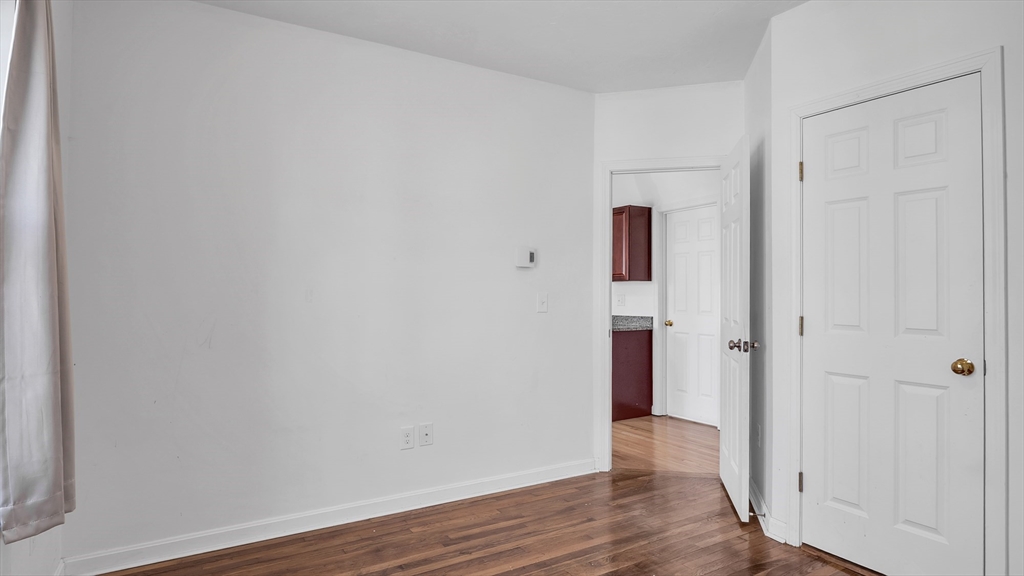 1442 Main Street, Unit 2 Worcester, MA 01603 - Photo 16 of 30 a view of an empty room with wooden floor