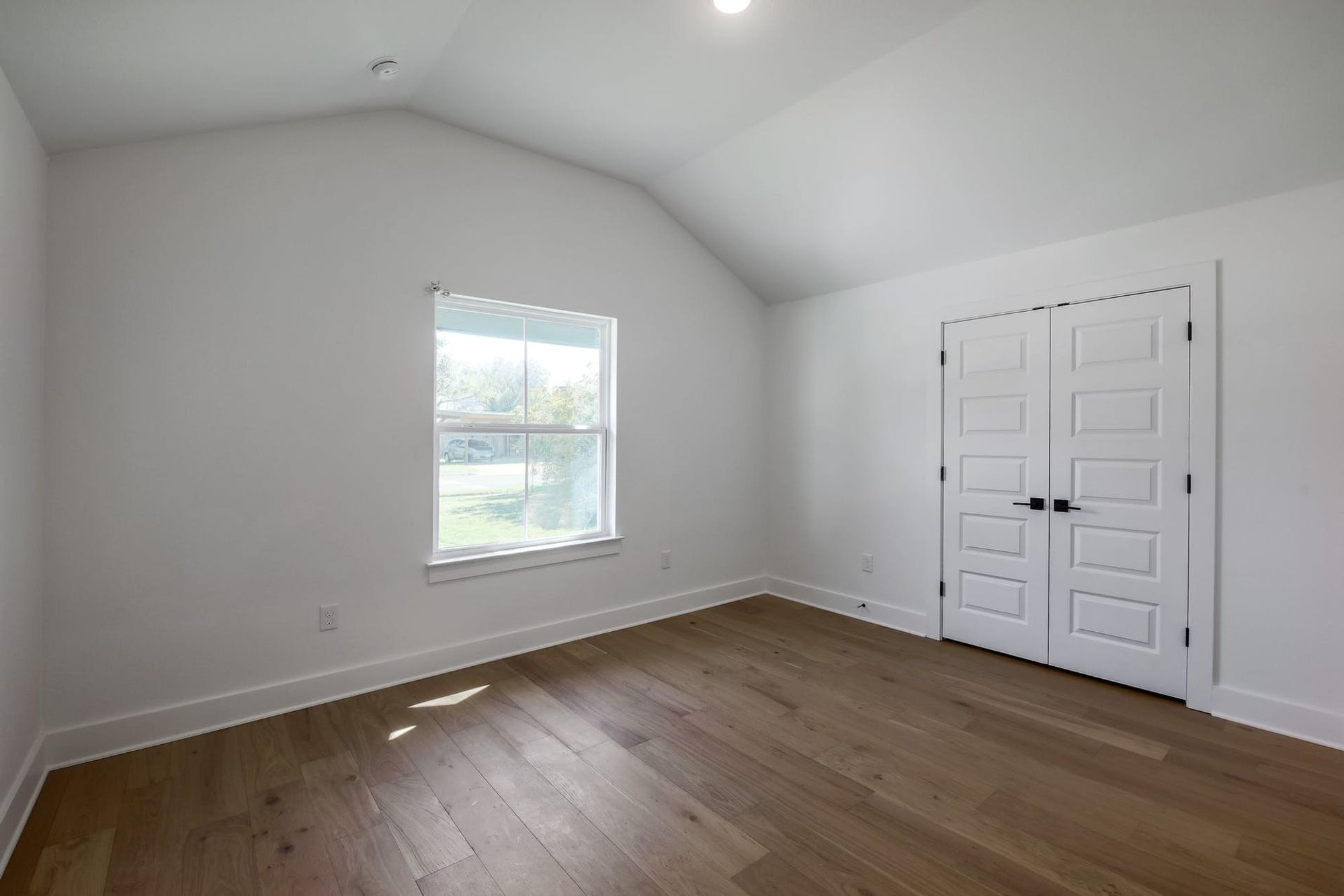 8302 Kromer Street Austin, TX 78757 - Photo 5 of 34 Additional living space featuring baseboards and dark wood finished floors