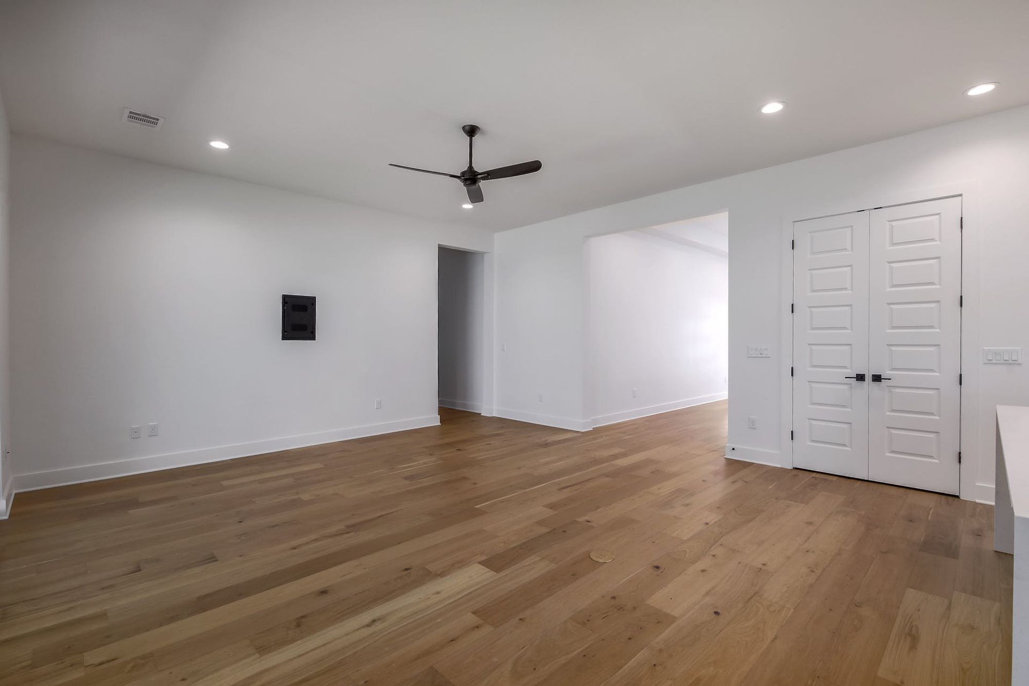 8302 Kromer Street Austin, TX 78757 - Photo 8 of 34 Empty room with a ceiling fan, recessed lighting, and light wood finished floors
