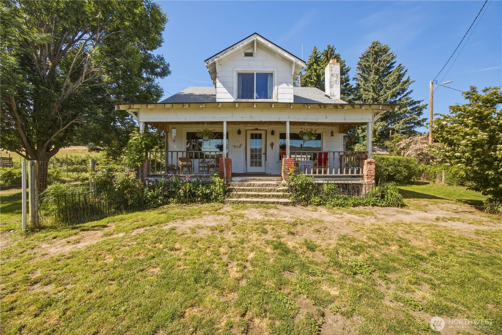 1281 Totem Pole Road Manson, WA 98831 - Photo 1 of 39 a front view of a house with a yard