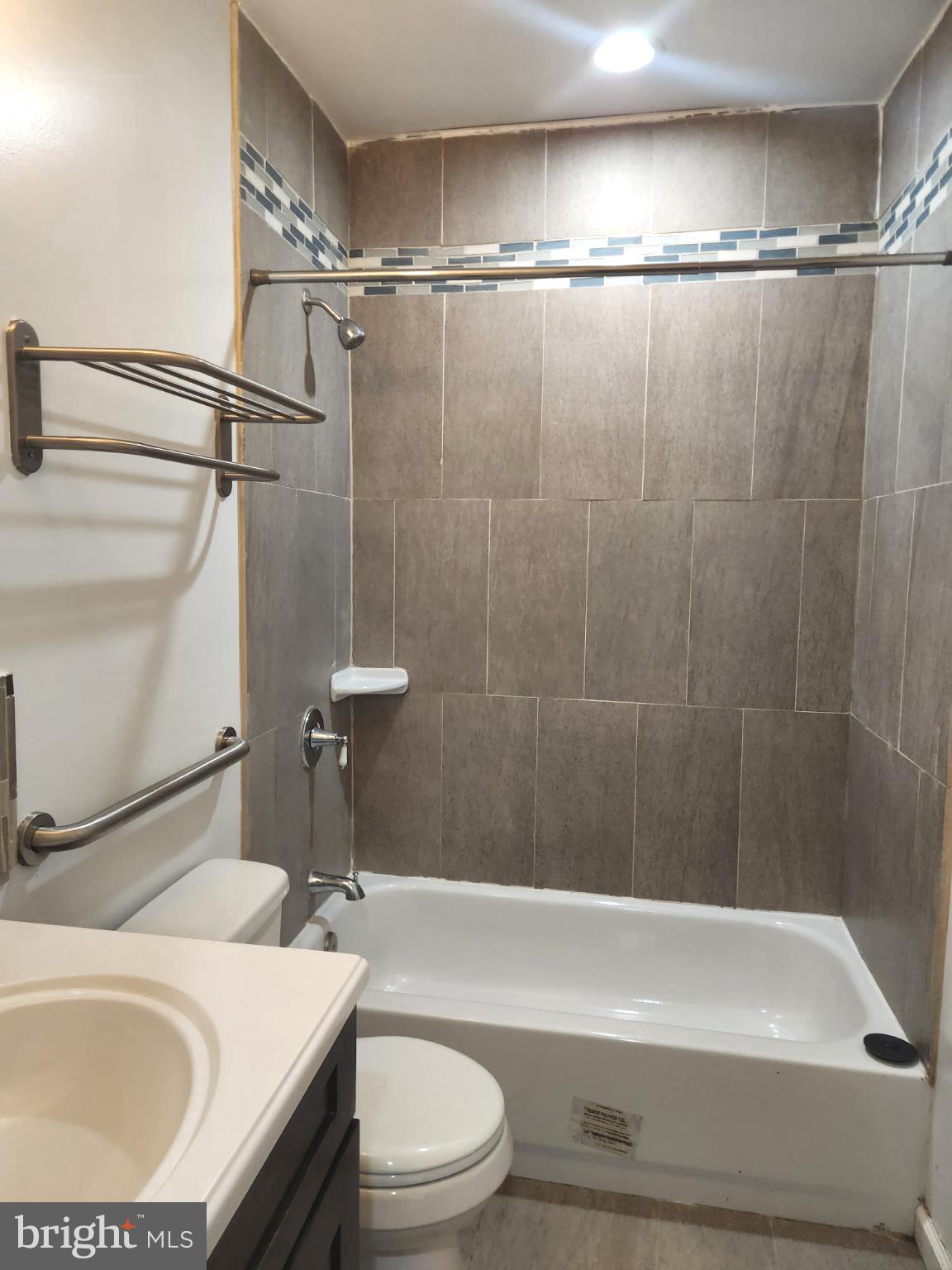 1421 West Baltimore Street, Unit 2 Baltimore, MD 21223 - Photo 13 of 24 Modern bathroom with elegant tile accents.