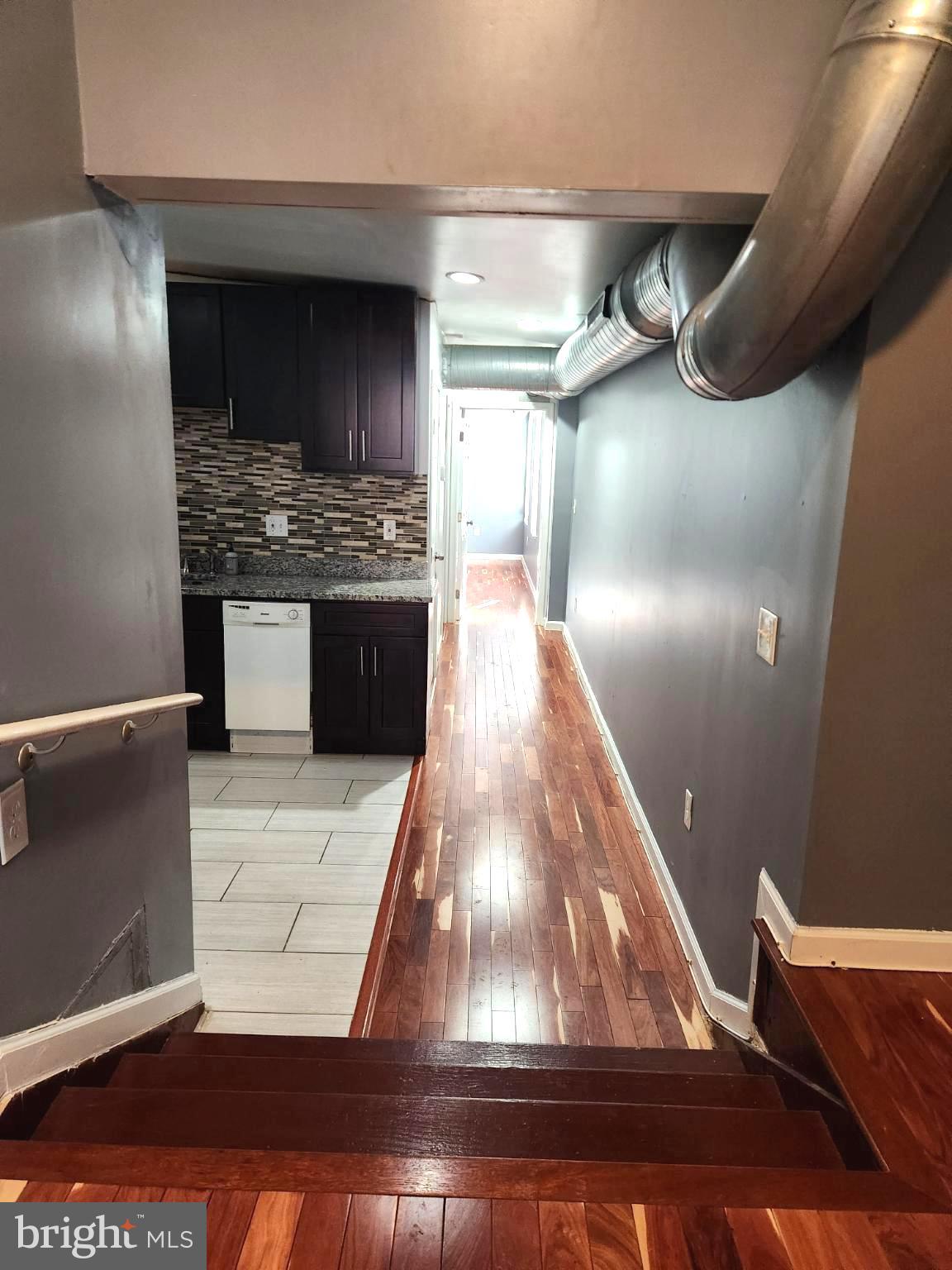 1421 West Baltimore Street, Unit 2 Baltimore, MD 21223 - Photo 5 of 24 Modern hallway w/ stairs leading to the kitchen.