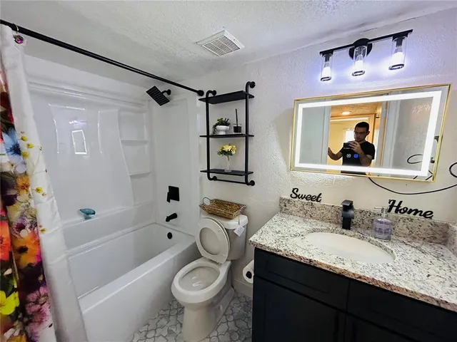 a bathroom with a shower and a tub