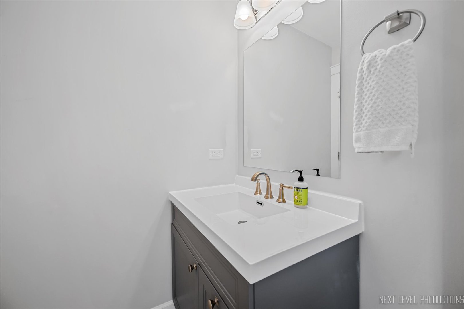 413 Cheever Avenue Geneva, IL 60134 - Photo 17 of 30 a bathroom with a sink and a mirror