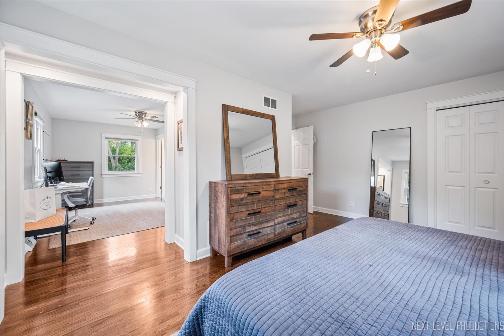 413 Cheever Avenue Geneva, IL 60134 - Photo 19 of 30 a bedroom with a bed and a chandelier