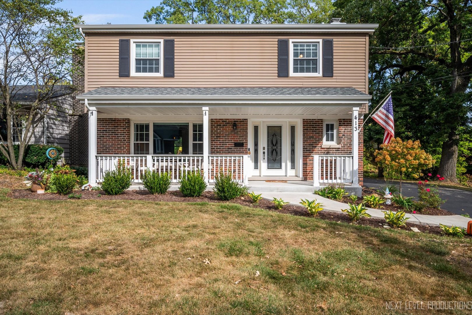 413 Cheever Avenue Geneva, IL 60134 - Photo 2 of 30 a house that has a large tree in front of it
