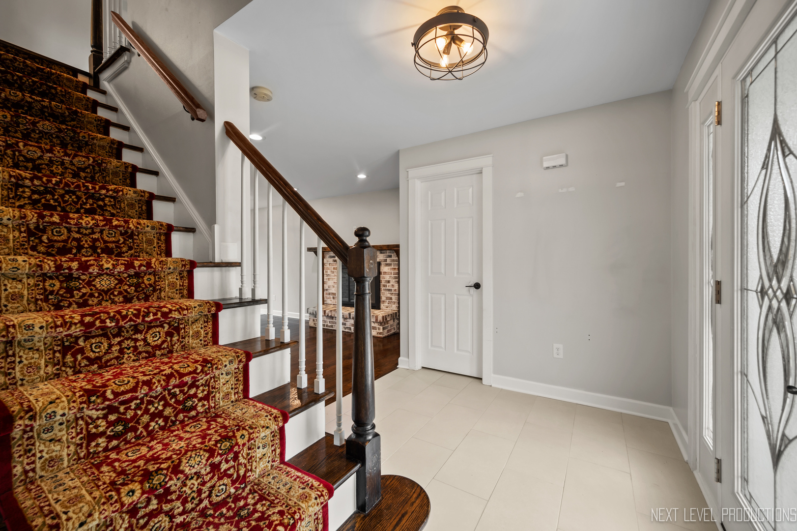 413 Cheever Avenue Geneva, IL 60134 - Photo 5 of 30 a view of entryway with stairs and wooden floor