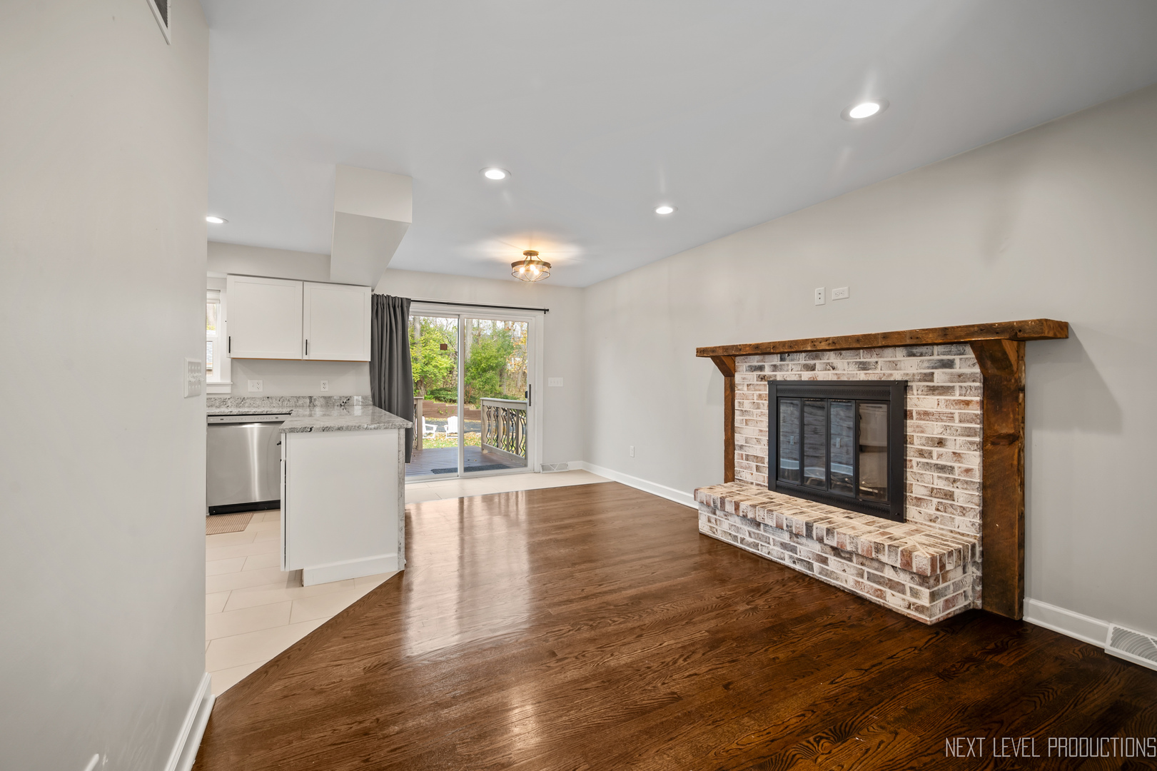 413 Cheever Avenue Geneva, IL 60134 - Photo 9 of 30 a living room with furniture and a fireplace