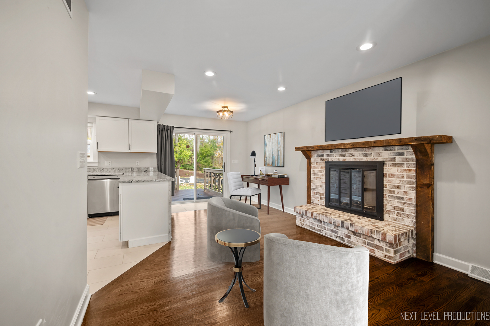 413 Cheever Avenue Geneva, IL 60134 - Photo 10 of 30 a living room with furniture a flat screen tv and a fireplace