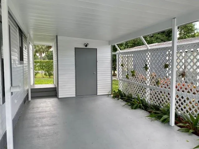 a view of a porch with wooden fence