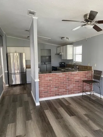 a view of kitchen with furniture and window