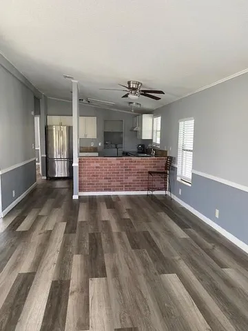 a view of living room with furniture and chandelier