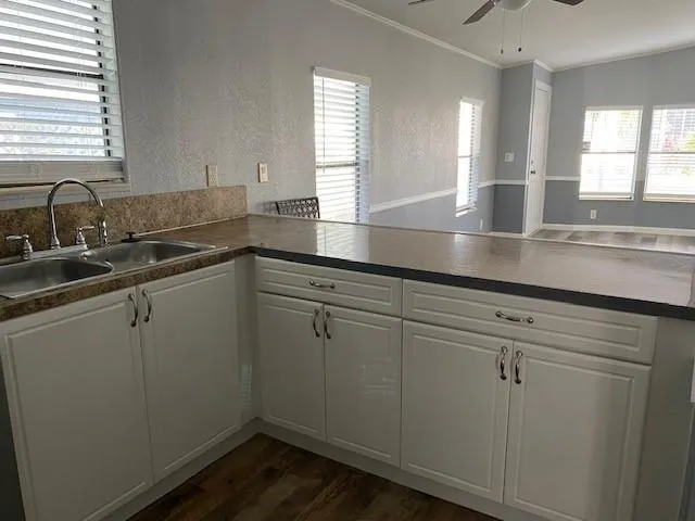 a kitchen with sink and window