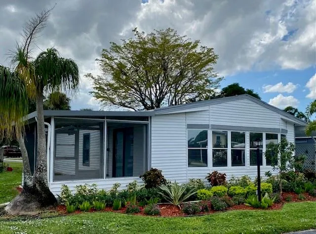 a house with garden in front of it