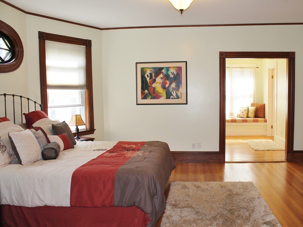 166 Chestnut Street Cambridge, MA 02139 - Photo 11 of 30 a bedroom with a bed and a window