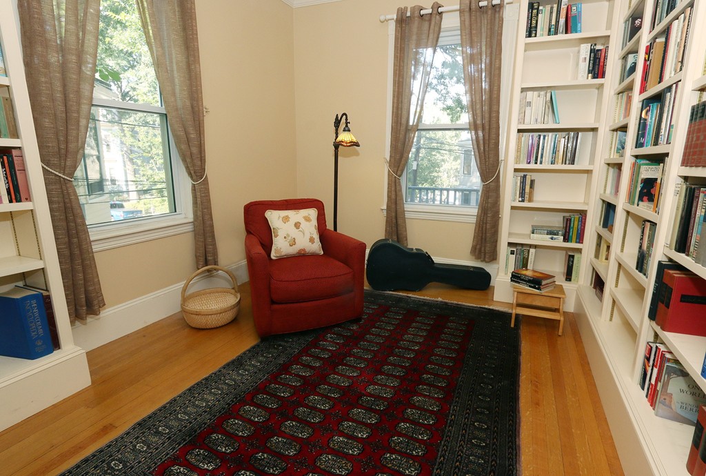 166 Chestnut Street Cambridge, MA 02139 - Photo 17 of 30 a living room with furniture and a rug