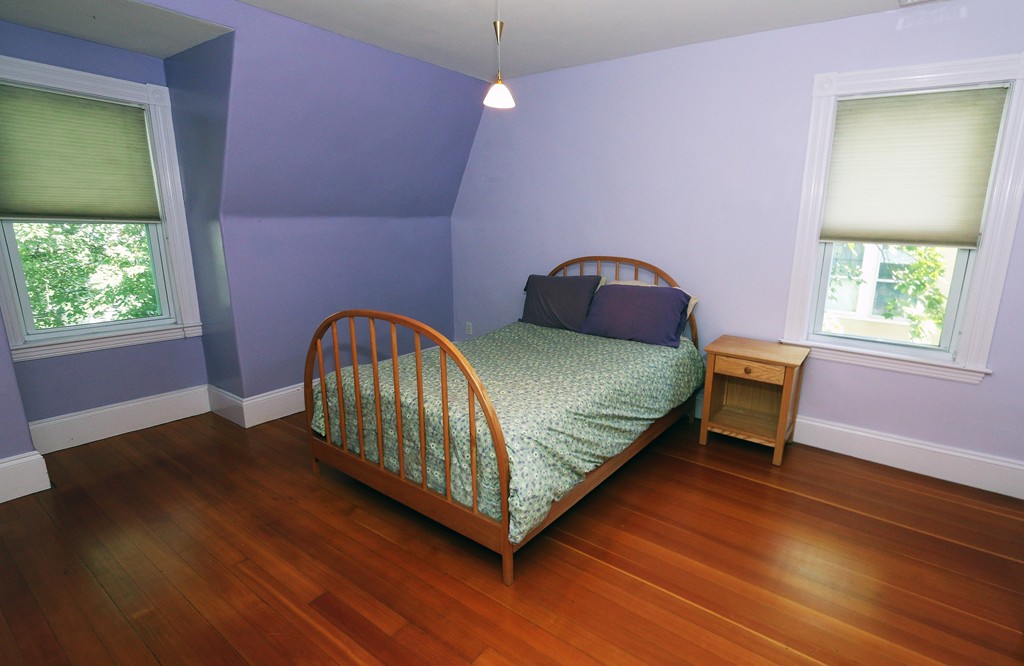 166 Chestnut Street Cambridge, MA 02139 - Photo 20 of 30 a bedroom with a bed and a window