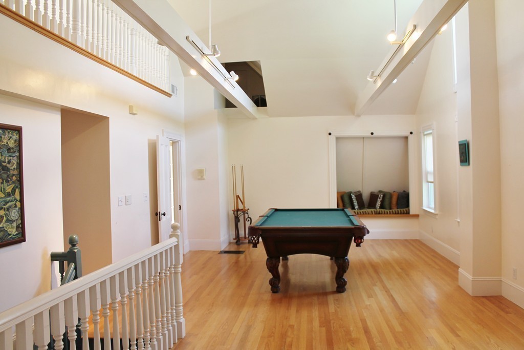 166 Chestnut Street Cambridge, MA 02139 - Photo 22 of 30 a living room with furniture and a wooden floor