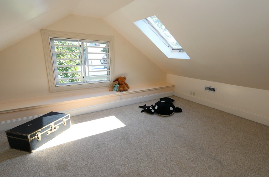 166 Chestnut Street Cambridge, MA 02139 - Photo 23 of 30 an empty room with windows and natural light