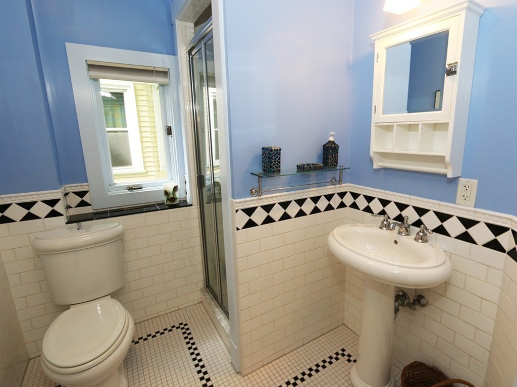 166 Chestnut Street Cambridge, MA 02139 - Photo 26 of 30 a bathroom with a sink toilet and mirror