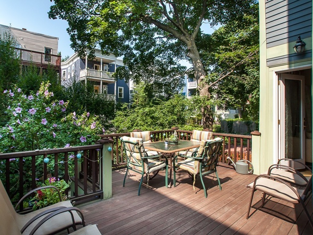 166 Chestnut Street Cambridge, MA 02139 - Photo 27 of 30 a view of a chairs and table on the wooden deck