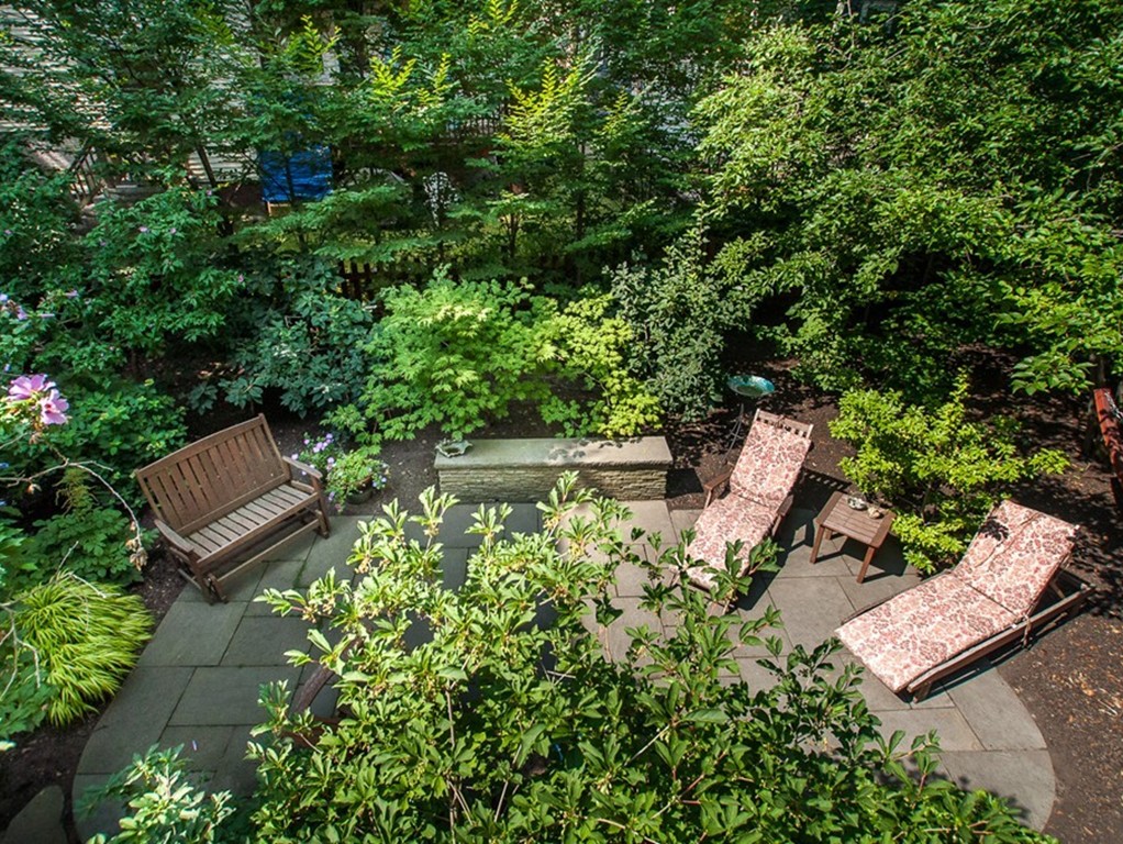 166 Chestnut Street Cambridge, MA 02139 - Photo 28 of 30 a view of a bench in backyard of a house