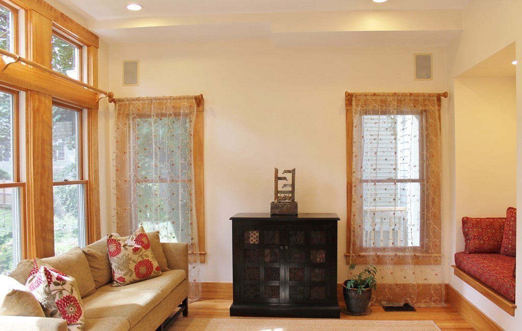 166 Chestnut Street Cambridge, MA 02139 - Photo 3 of 30 a living room with furniture and a fireplace