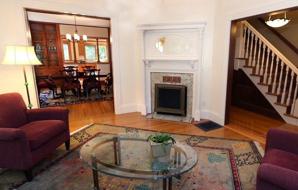 166 Chestnut Street Cambridge, MA 02139 - Photo 8 of 30 a living room with furniture and a fireplace