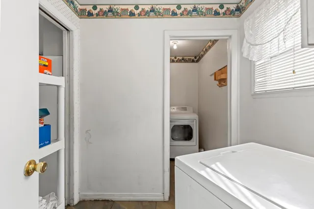 a utility room with dryer and washer