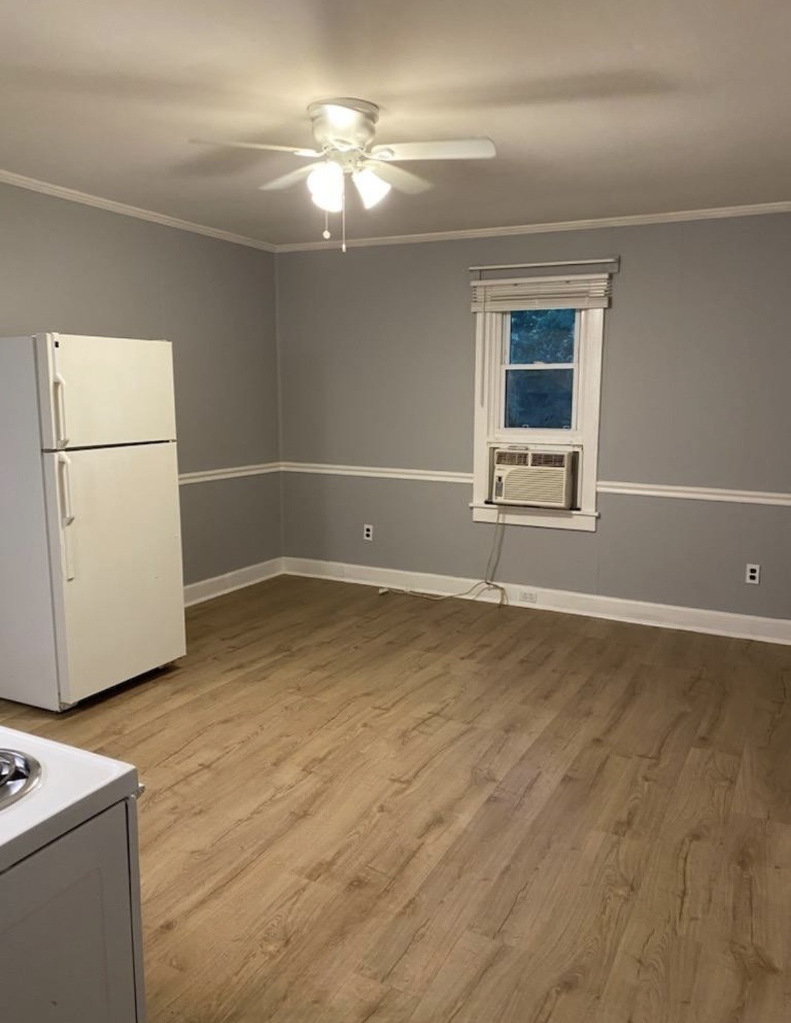 424 Jones Street Pulaski, TN 38478 - Photo 7 of 8 a view of empty room with wooden floor and fan