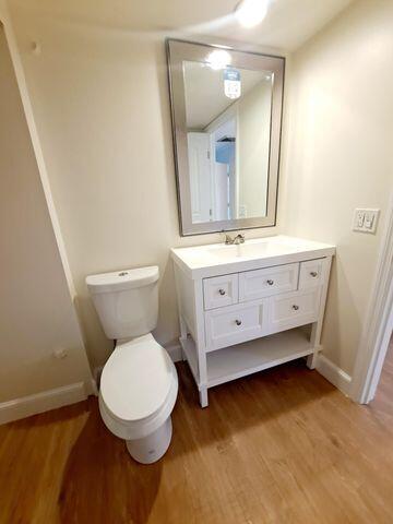 3900 County Line Road, Unit 16A Tequesta, FL 33469 - Photo 15 of 27 a bathroom with a toilet sink and mirror