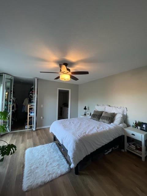 3900 County Line Road, Unit 16A Tequesta, FL 33469 - Photo 18 of 27 a bedroom with a bed and a chandelier