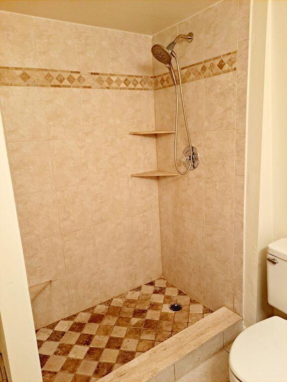 3900 County Line Road, Unit 16A Tequesta, FL 33469 - Photo 20 of 27 a bathroom with a sink and a shower